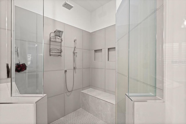 bathroom featuring tiled shower