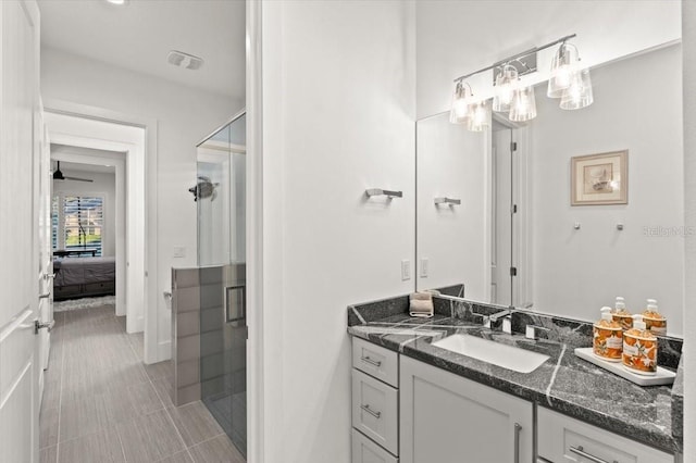 bathroom with vanity, tile patterned floors, and walk in shower