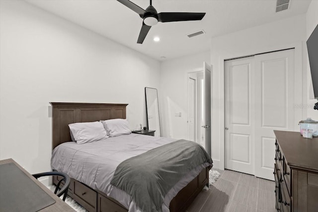 bedroom with ceiling fan and a closet