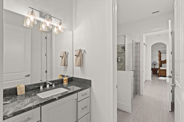 bathroom with vanity and an enclosed shower