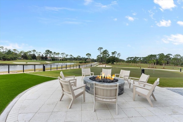 view of patio featuring a fire pit and a water view