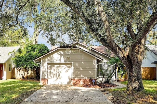 exterior space featuring a lawn and a garage