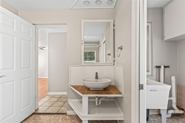 bathroom with tile patterned flooring and sink