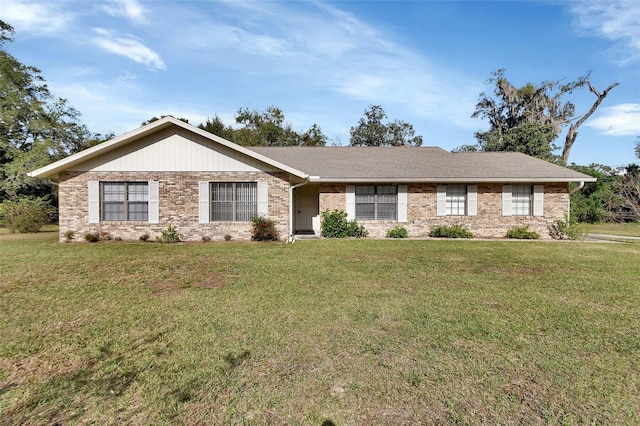 ranch-style home with a front lawn