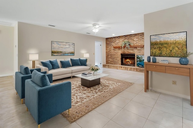 living room featuring ceiling fan, light tile patterned floors, and a brick fireplace