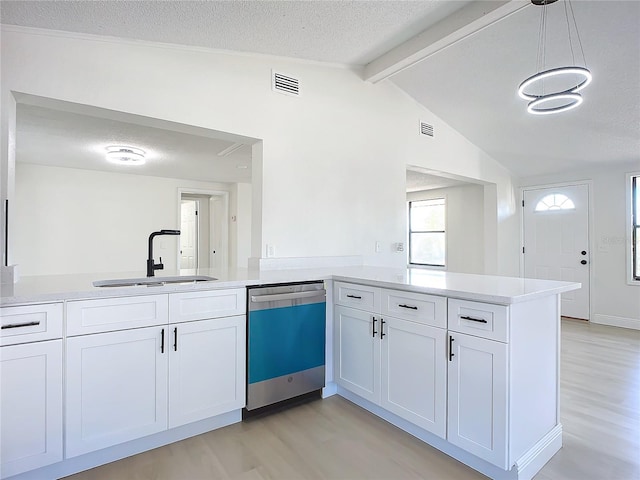 kitchen featuring dishwasher, light hardwood / wood-style floors, kitchen peninsula, and sink