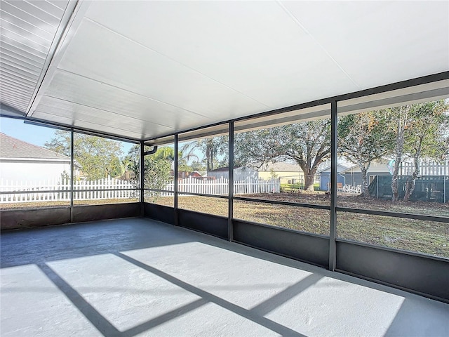 unfurnished sunroom featuring a healthy amount of sunlight