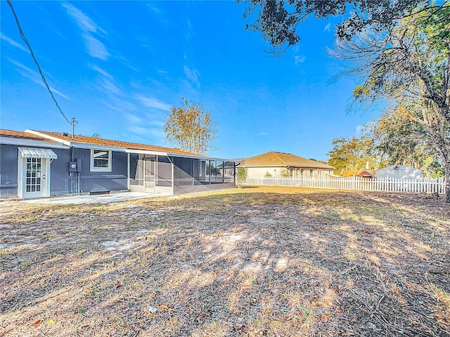 back of property with a patio