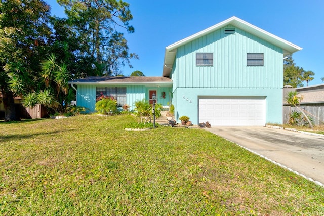 view of front of property with a garage and a front yard