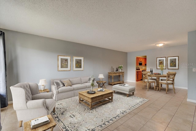 living room featuring light tile patterned floors and a textured ceiling