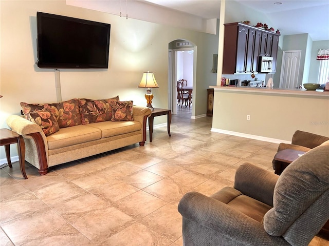 living room featuring vaulted ceiling