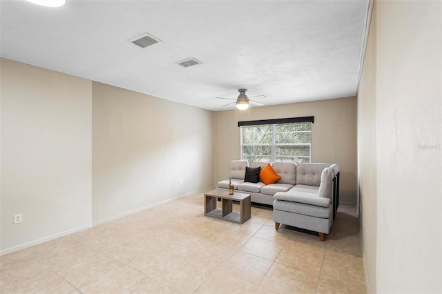 living room featuring ceiling fan and light tile patterned flooring