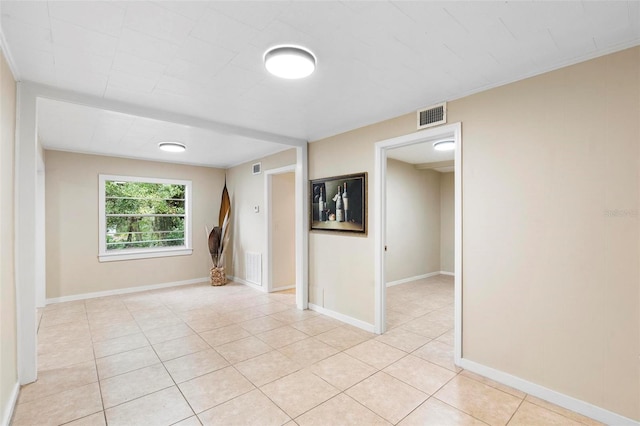 spare room with light tile patterned flooring