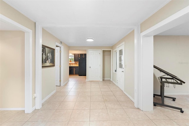 hallway with light tile patterned flooring