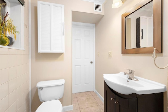 bathroom with tile patterned flooring, vanity, toilet, and ornamental molding