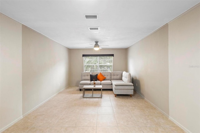 living room featuring ceiling fan and light tile patterned floors