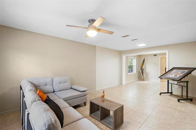 living room with light tile patterned floors and ceiling fan