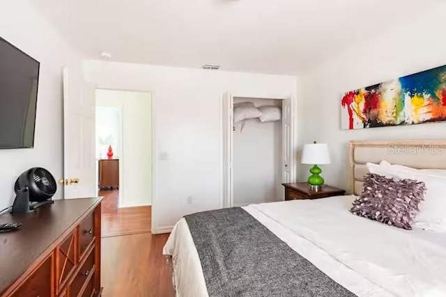 bedroom with light wood-type flooring