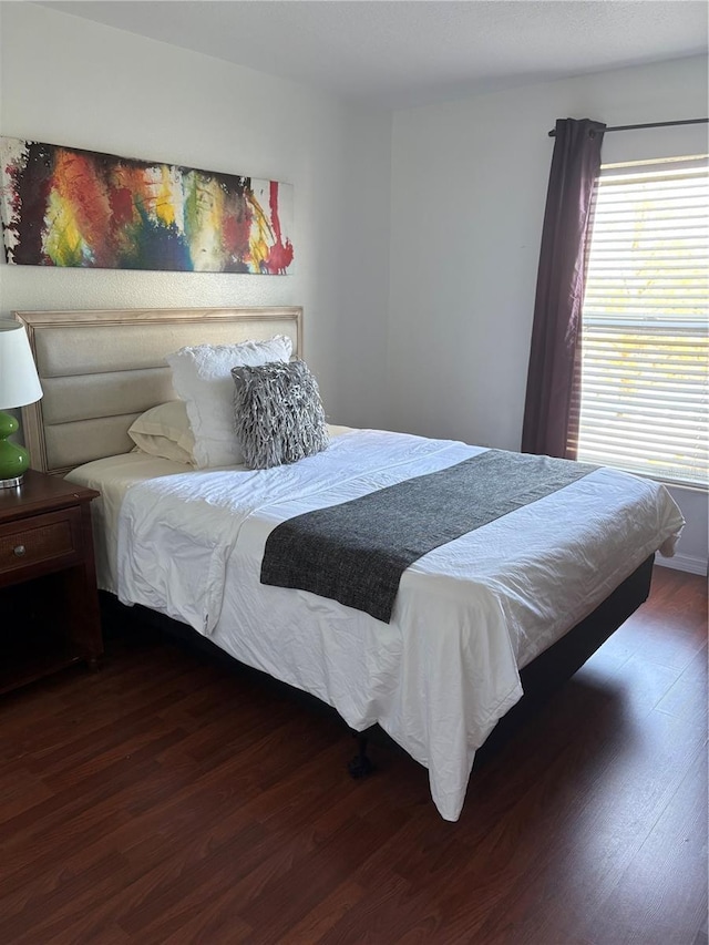 bedroom featuring dark wood-type flooring