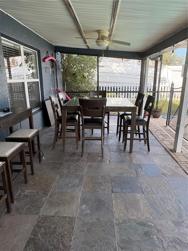 sunroom / solarium with ceiling fan