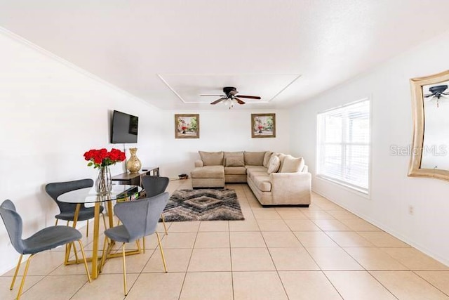 tiled living room featuring ceiling fan