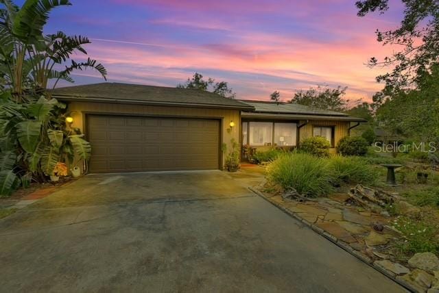 single story home with a garage