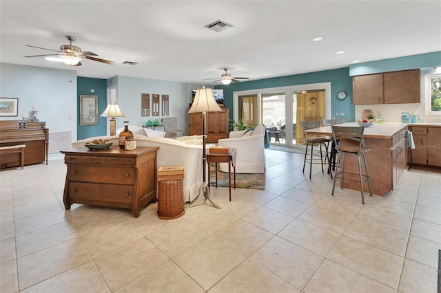 interior space with ceiling fan and a wealth of natural light