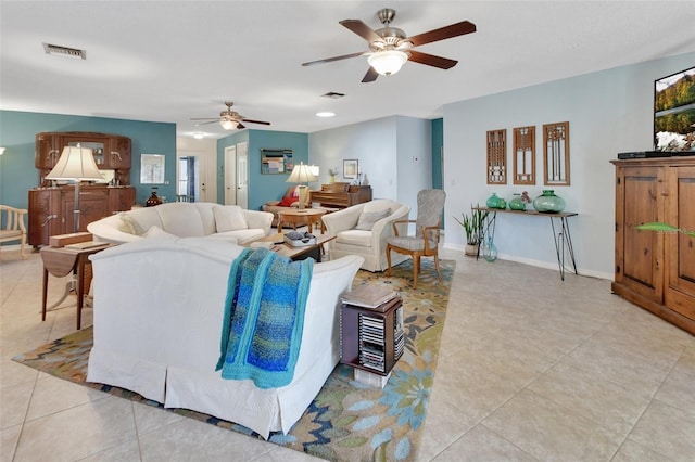 tiled living room with ceiling fan