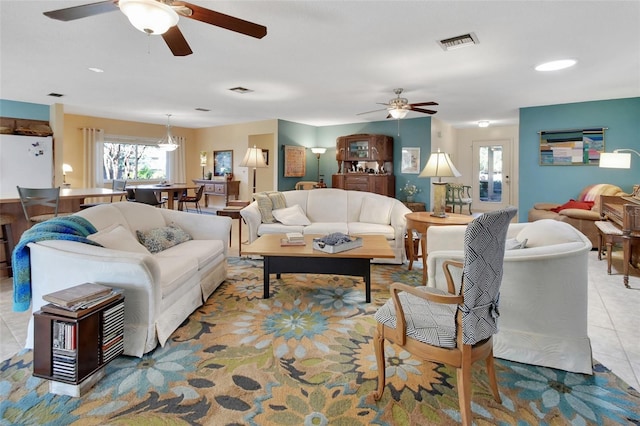 living room featuring ceiling fan and light tile patterned floors