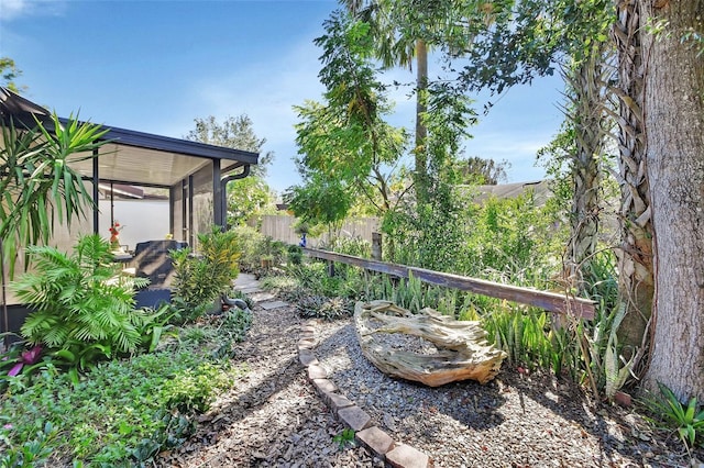 view of yard featuring a sunroom