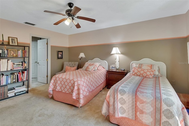 bedroom featuring ceiling fan and light carpet