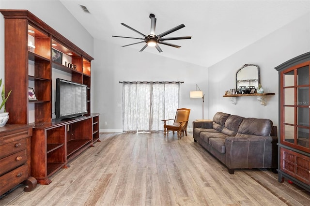 living room featuring ceiling fan, light hardwood / wood-style floors, and lofted ceiling