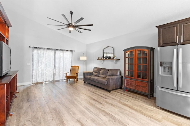 living room with ceiling fan, light wood-type flooring, and high vaulted ceiling