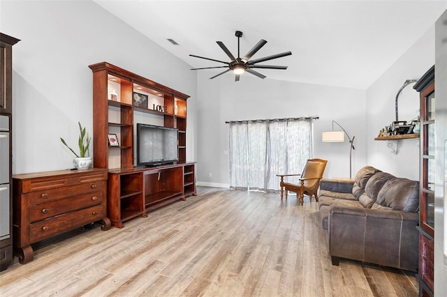 living room with ceiling fan, light wood-type flooring, and vaulted ceiling