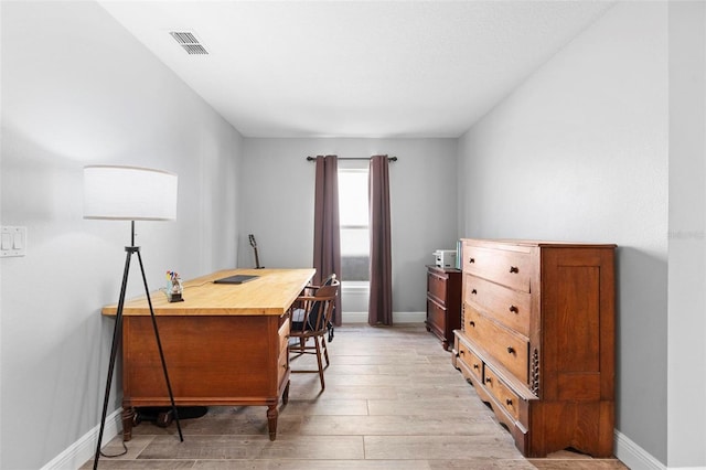 home office featuring light wood-type flooring