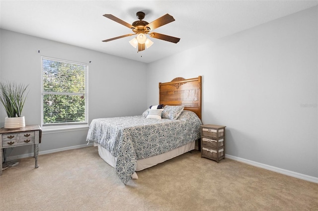 bedroom featuring ceiling fan and light colored carpet