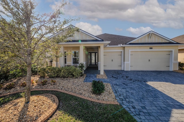 view of front of house with covered porch and a garage