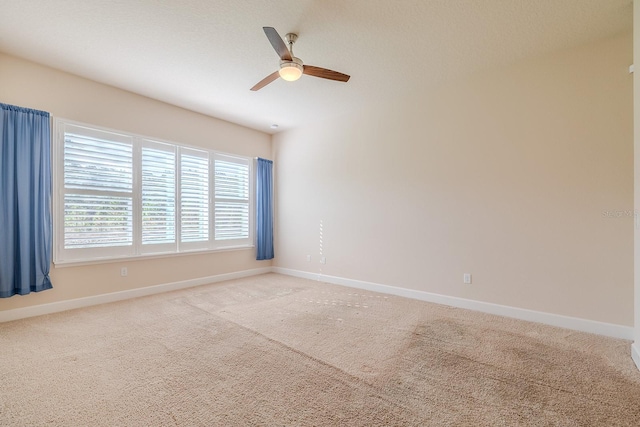 unfurnished room with light carpet and ceiling fan