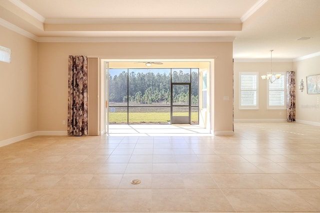 empty room with an inviting chandelier, crown molding, and light tile patterned flooring