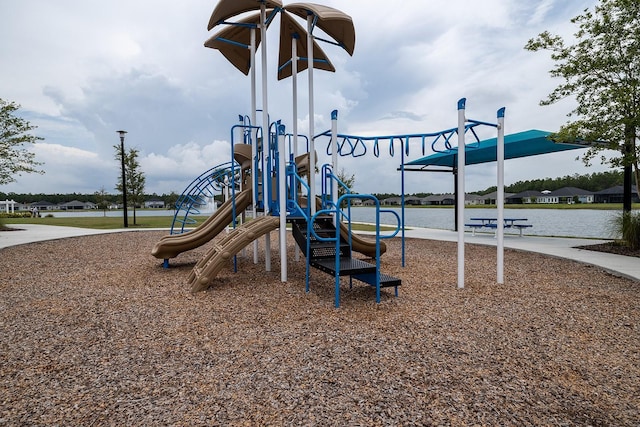 view of jungle gym with a water view