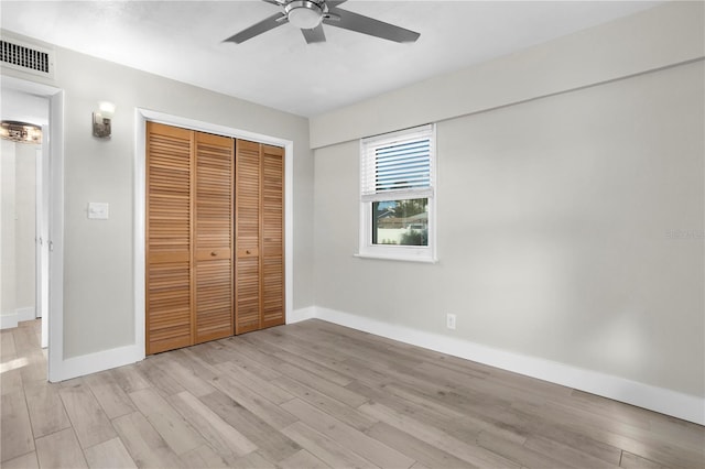 unfurnished bedroom with a closet, ceiling fan, and light hardwood / wood-style floors