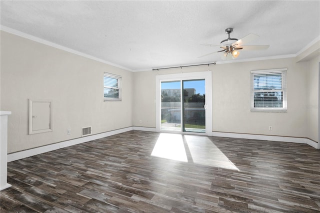 empty room with ceiling fan, dark hardwood / wood-style flooring, and crown molding