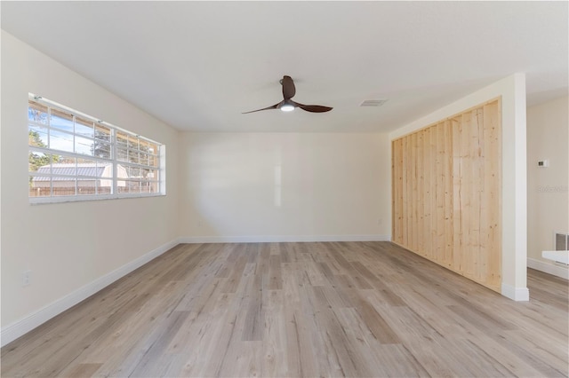 unfurnished room featuring ceiling fan and light wood-type flooring