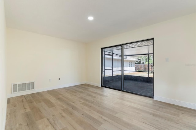 unfurnished room featuring light hardwood / wood-style flooring