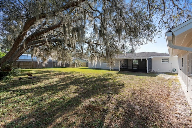 view of yard with a sunroom