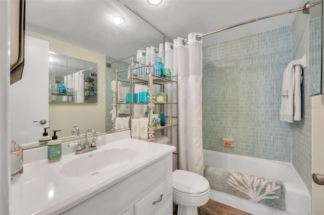 full bathroom featuring vanity, toilet, and shower / bathtub combination with curtain