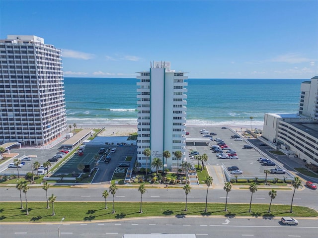 bird's eye view with a water view and a view of the beach