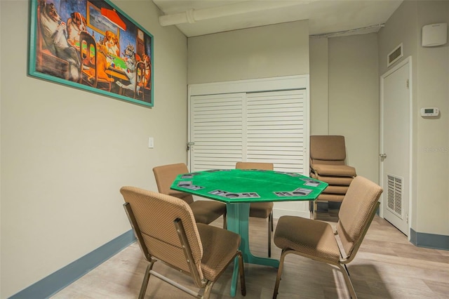 playroom featuring visible vents, light wood-style flooring, and baseboards