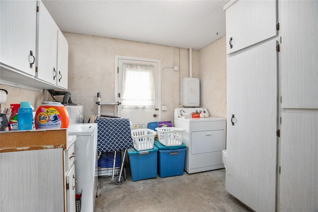 laundry room with cabinets, independent washer and dryer, and a textured ceiling