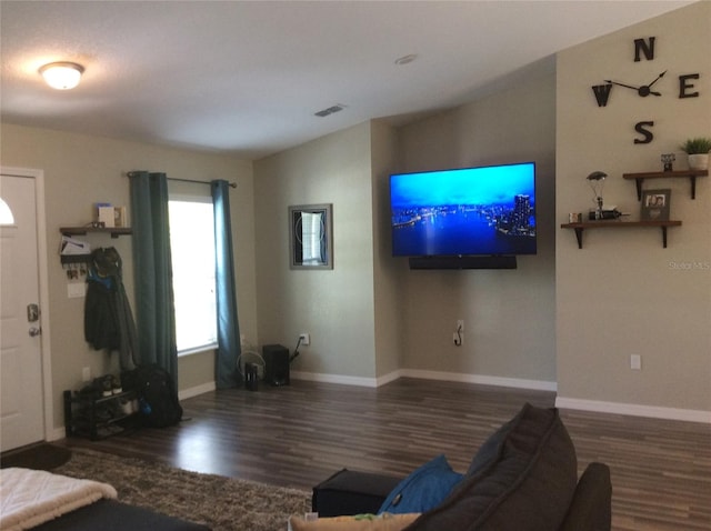 living room with dark hardwood / wood-style floors